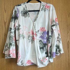White floral boutique bell sleeve cross over front.
